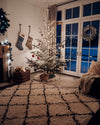 Handmade moroccan rug on a living room cozy with christmas decor