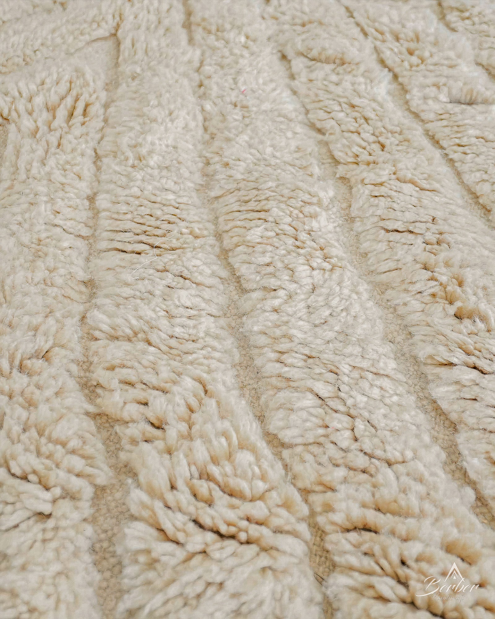 Close-up of textured beige fabric with a subtle pattern