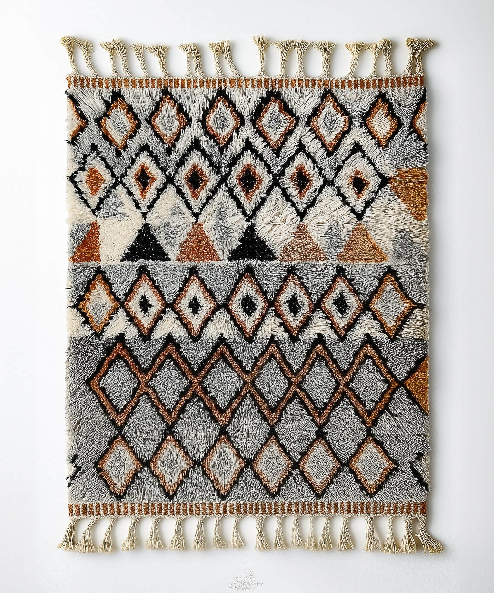 Handmade Moroccan rug with grey geometric pattern in vintage style and tassels on a white background