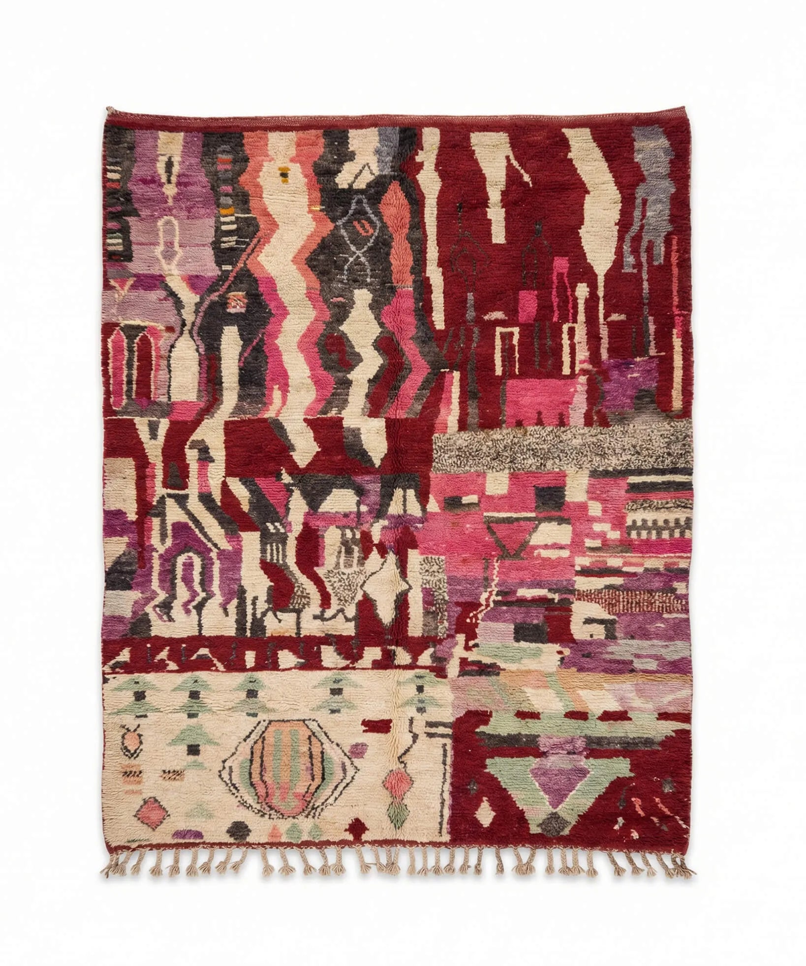 Multicolored patterned rug with geometric design on a white background